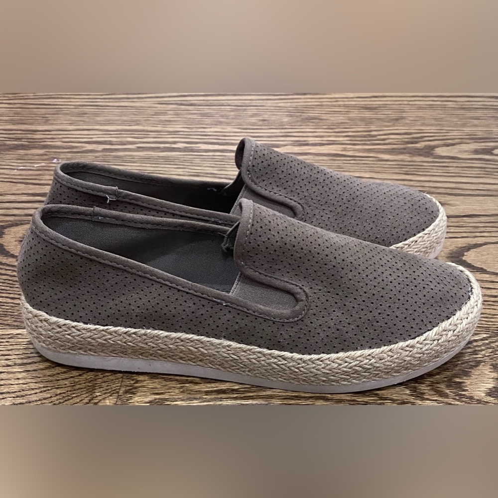 Bohemian loafers with intricate peep holes and twine detailing on heel